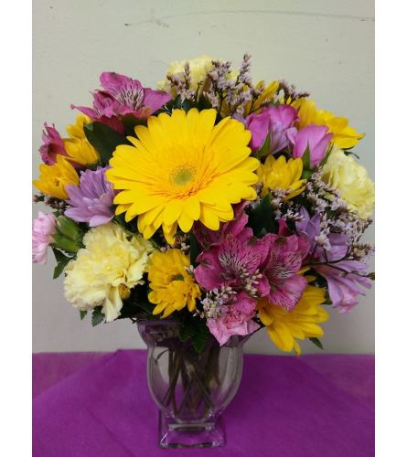 April Rays. An arrangement by Avenue Flowers and Gifts.