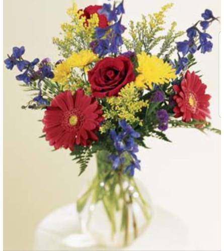 Red Summer. An arrangement by Avenue Flowers and Gifts.