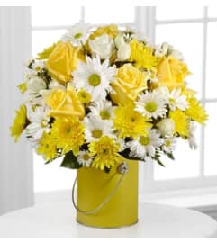 Sunshines. An arrangement by Avenue Flowers and Gifts.