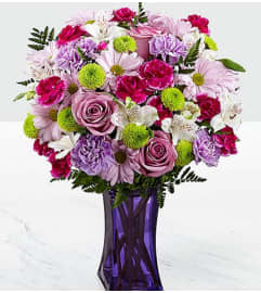 Purple Pops. An arrangement by Avenue Flowers and Gifts.