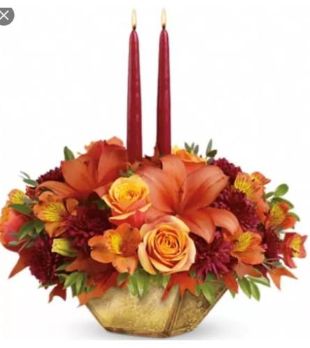 Gold Harvest center. An arrangement by Avenue Flowers and Gifts.