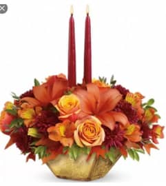 Gold Harvest center. An arrangement by Avenue Flowers and Gifts.