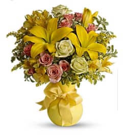 Sun and Smiles. An arrangement by Avenue Flowers and Gifts.
