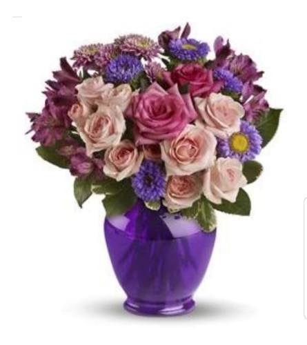 Purple Punch. An arrangement by Avenue Flowers and Gifts.