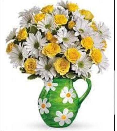 yellow rose and happy Daisy pitcher. An arrangement by Avenue Flowers and Gifts.