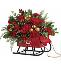 Saint Nicholas Tree Farm Sleigh. An arrangement by Avenue Flowers and Gifts.