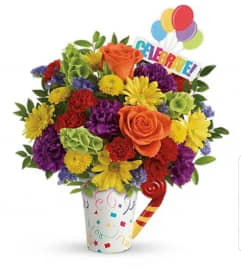 Cheers to Your Celebration Surprise. An arrangement by Avenue Flowers and Gifts.