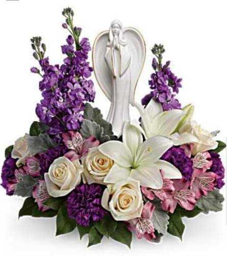 Angel in Purple Garden. An arrangement by Avenue Flowers and Gifts.