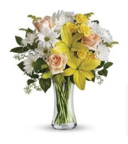 Sunbeams and Daisies. An arrangement by Avenue Flowers and Gifts.