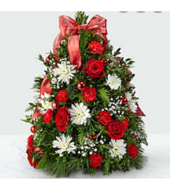 Beautiful Boxwood tree Arrangement. An arrangement by Avenue Flowers and Gifts.