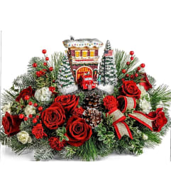 Festive Fire House By Thomas Kinkade. An arrangement by Avenue Flowers and Gifts.