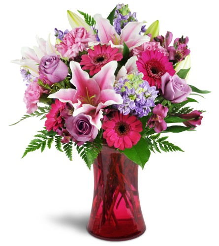 Bright Medley™ - Deluxe. An arrangement by Avenue Flowers and Gifts. This arrangement includes a lively combination of Stargazer lilies, bright...