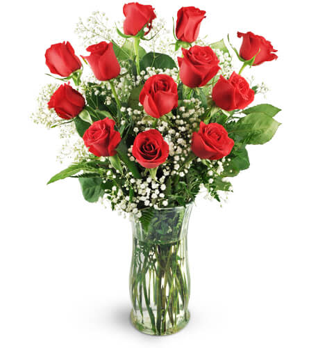 12 Classic Red Roses. An arrangement by Avenue Flowers and Gifts. Lush red roses and baby’s breath are lavishly designed to create a moment...