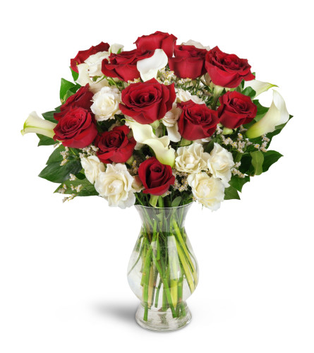 Love You Forever™ Bouquet - Deluxe. An arrangement by Avenue Flowers and Gifts. Nine red roses are arranged with white spray roses, lush mini...