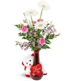 Darling Daisies™ with Love Bear. An arrangement by Avenue Flowers and Gifts.