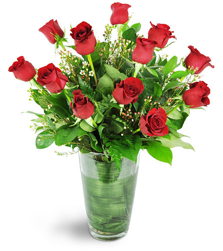 True Romance. An arrangement by Avenue Flowers and Gifts. One dozen lovely red roses are arranged with waxflower, Italian Ruscus, and assorted...