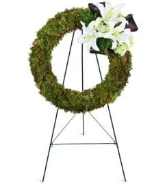 Earth's Jewel Wreath™. An arrangement by Avenue Flowers and Gifts.