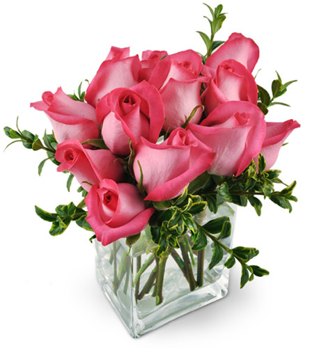 Pink Infatuation. An arrangement by Avenue Flowers and Gifts. Twelve stunning hot-pink roses are arranged with fresh oregonia in a modern glass vase..