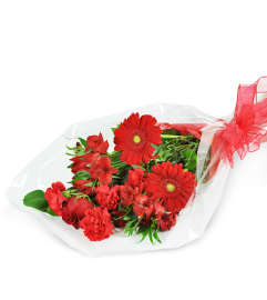 Red Romance, Wrapped Bouquet. An arrangement by Avenue Flowers and Gifts.