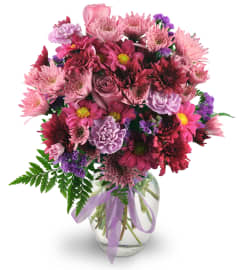 Purple Moon. An arrangement by Avenue Flowers and Gifts.