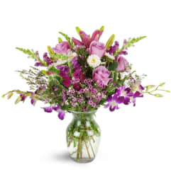 Purple Paradise Orchid Bouquet™. An arrangement by Avenue Flowers and Gifts.