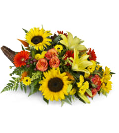 Giving Thanks Cornucopia™. An arrangement by Avenue Flowers and Gifts.