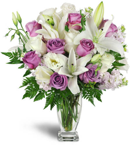 Sweet as Sugar Bouquet™ - Deluxe. An arrangement by Avenue Flowers and Gifts. White and lavender roses are arranged with Asiatic lilies, stock,...