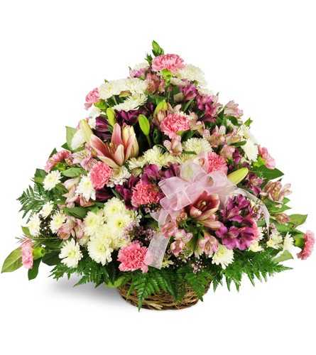 Amethyst Sunset Sympathy Basket™. An arrangement by Avenue Flowers and Gifts. Gorgeous pink lilies are arranged with mini carnations,...