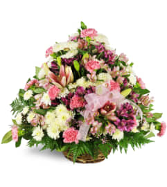 Amethyst Sunset Sympathy Basket™. An arrangement by Avenue Flowers and Gifts.