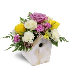 Birdhouse of Blooms. An arrangement by Avenue Flowers and Gifts.