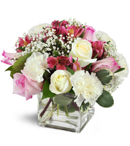 Blushing Blessings Cube™ - Deluxe. An arrangement by Avenue Flowers and Gifts. Handcrafted with pink roses, pink Peruvian lilies, and white...