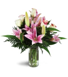 Alluring Roses and Lilies™. An arrangement by Avenue Flowers and Gifts.