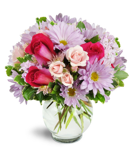 Sweet Surprise™ - Deluxe. An arrangement by Avenue Flowers and Gifts. Hot pink roses stand out among light pink and lavender daisies, spray roses,...