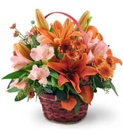 Sunset Basket. An arrangement by Avenue Flowers and Gifts.