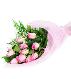 Perfect Wrapped Long-Stemmed Pink Roses. An arrangement by Avenue Flowers and Gifts.