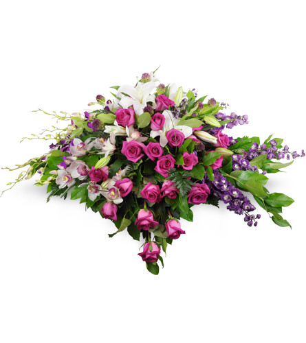 Forever Adored Casket Spray. An arrangement by Avenue Flowers and Gifts. Two dozen fuchsia roses are elegantly arranged with Cymbidium orchids,...