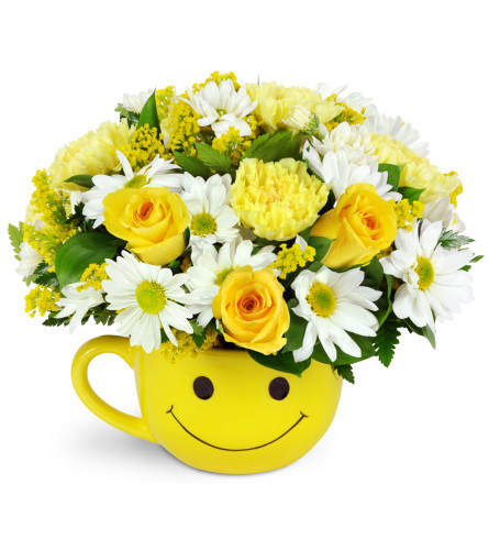 Full of Smiles - Deluxe. An arrangement by Avenue Flowers and Gifts. Yellow carnations, white daisies, and solidago are arranged in a smiley-face...