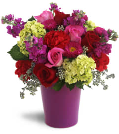 Bursting with Blooms™. An arrangement by Avenue Flowers and Gifts.