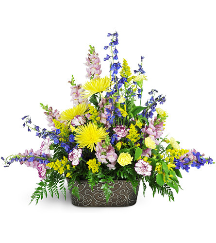 Garden Path Tribute. An arrangement by Avenue Flowers and Gifts. Fuji mums, delphinium, snapdragons, alstroemeria, and more, all in shades of...