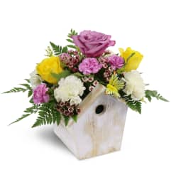 Birdhouse of Blooms. An arrangement by Avenue Flowers and Gifts.