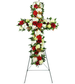 Love and Prayers Sympathy Cross™. An arrangement by Avenue Flowers and Gifts.