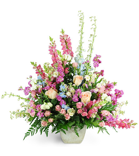 Adoring Tribute. An arrangement by Avenue Flowers and Gifts. Honor someone special with this Adoring Tribute overflowing with roses, spray roses,...