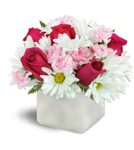 Vibrant Blooms™ - Deluxe. An arrangement by Avenue Flowers and Gifts. Hot pink roses are beautifully arranged with soft pink mini carnations and...