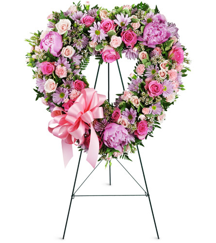 With Open Hearts™. An arrangement by Avenue Flowers and Gifts. Roses, peonies, daisies, and more are elegantly arranged for display at the funeral...