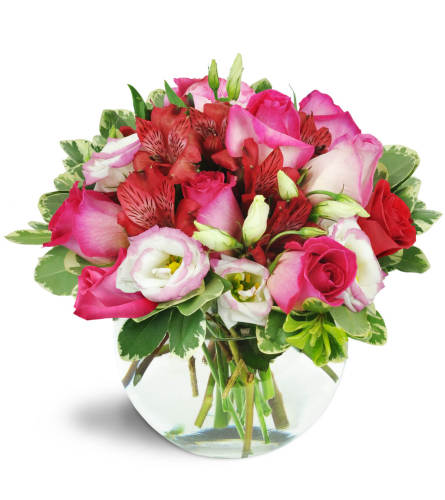 Cupid's Arrow™ - Deluxe. An arrangement by Avenue Flowers and Gifts. Pink roses, creamy lisianthus, lush red alstroemeria, and more burst from a...
