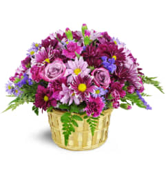 Amethyst Skies Basket™. An arrangement by Avenue Flowers and Gifts.