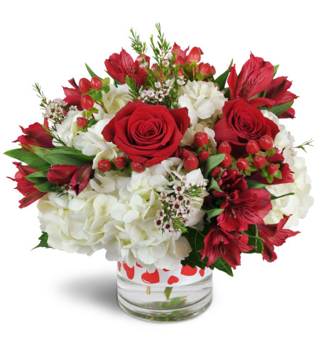 You're the One™ - Deluxe. An arrangement by Avenue Flowers and Gifts. White hydrangea and red Peruvian lilies are accented with waxflower, ribbon,...