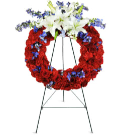 Passionate Grace Wreath™. An arrangement by Avenue Flowers and Gifts.