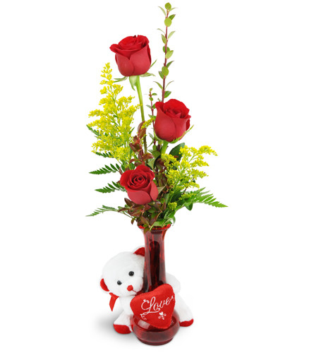 Rose Trio™ with Love Bear. An arrangement by Avenue Flowers and Gifts. Three red roses are arranged with greenery and encircled by a white plush...