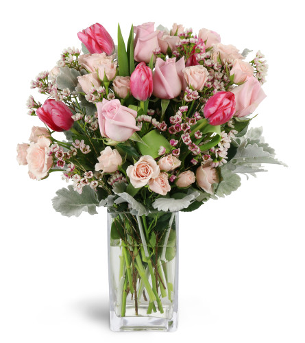 Sweetly Scented Pinks™ - Deluxe. An arrangement by Avenue Flowers and Gifts. Gift them an abundance of pink roses, spray roses, tulips, waxflower,...